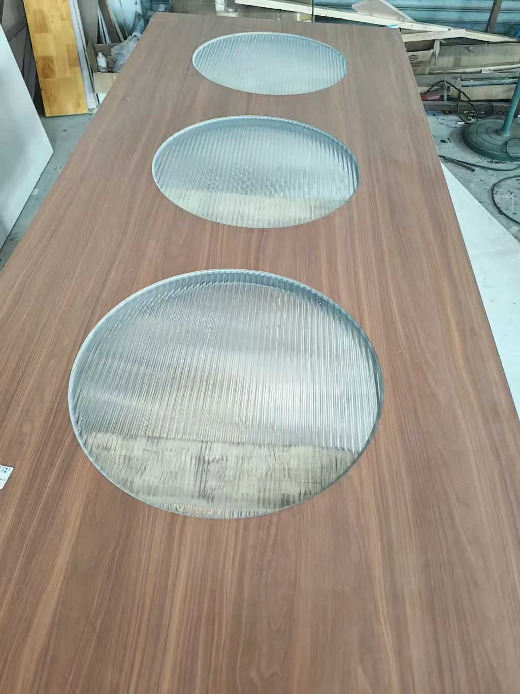 Wooden panel with circular glass inserts