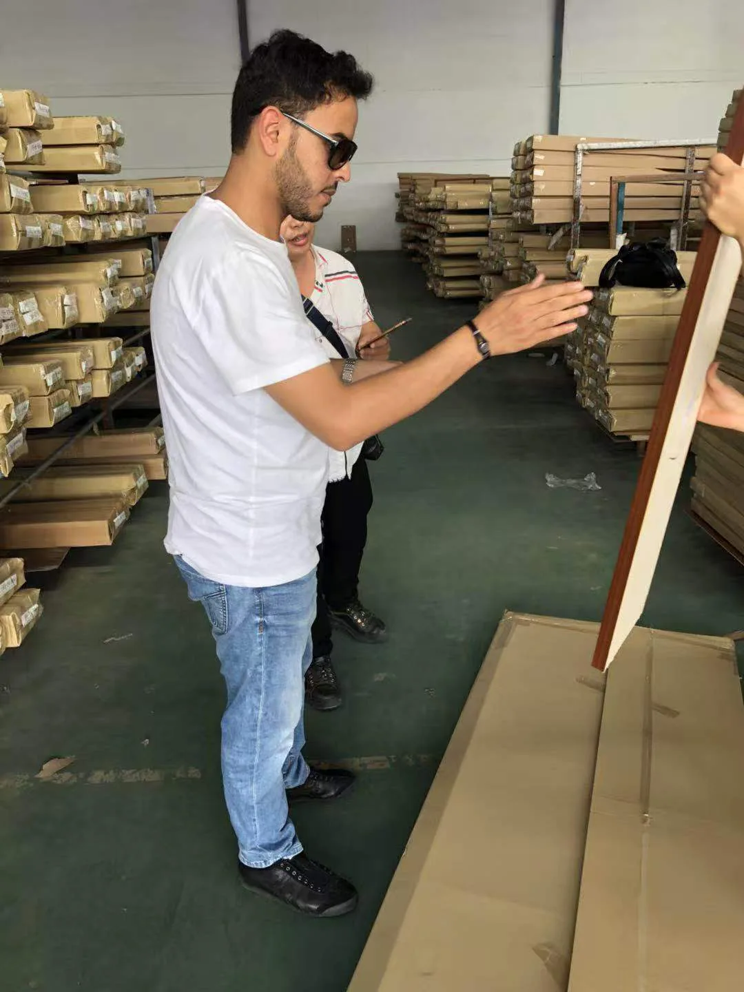 Visitor looking at a product in the workshop